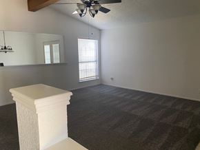 Killeen house for rent - A room with a carpeted floor and a white pedestal in the foreground.