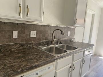 Killeen house for rent - A kitchen with a sink and a dishwasher.