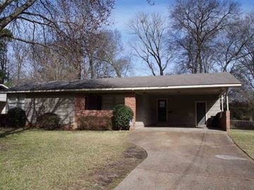 Jackson house for rent - a brick house with a driveway in front of it