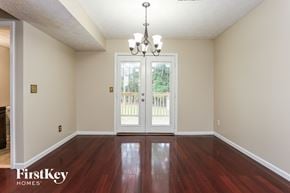 Loganville house for rent - the living room after renovation with hardwood flooring and doors