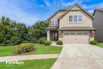St Charles house for rent - a house with a driveway and a garage door