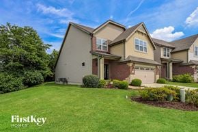 St Charles house for rent - a large house with a lawn and a driveway