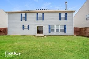 Fishers house for rent - A two-story house with a grey exterior and blue shutters.