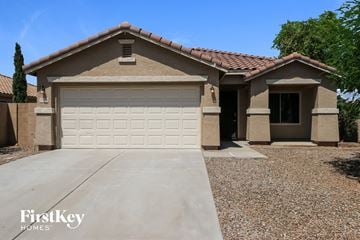 Queen Creek house for rent - a house with a white garage door in front of it