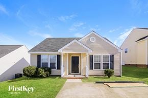 Knightdale house for rent - a home with a front porch and a lawn
