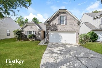 Charlotte house for rent - a white and gray brick house with a white garage door