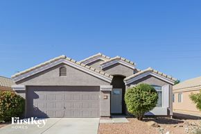 Tolleson house for rent - a single story home with a garage and a blue sky