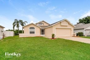 Winter Haven house for rent - A house with a well-maintained lawn and a clear sky.