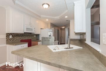Covington house for rent - a kitchen with a sink and a counter top