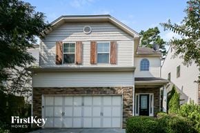Ball Ground house for rent - a white house with a white garage door