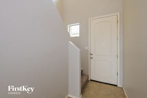 Vail house for rent - A white door is in a room with a window above it.