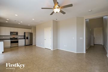 Vail house for rent - A spacious kitchen and living room with a ceiling fan.