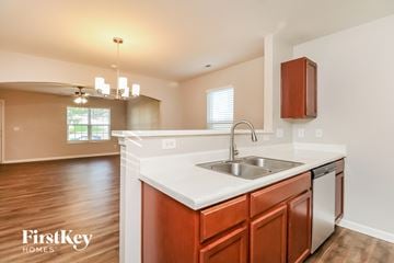 Charlotte house for rent - A kitchen with a sink and a FirstKey Homes logo.