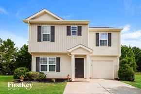 Charlotte house for rent - A two-story house with a garage is for sale.