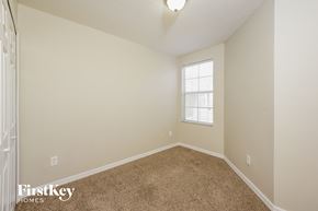 Orlando house for rent - a spacious room with carpet and a window