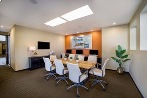 Phoenix apartment for rent - a conference room with a wooden table and chairs