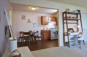 Madison Heights apartment for rent - A kitchen with a dining table and chairs.