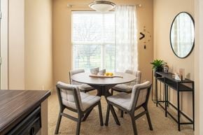 Council Bluffs apartment for rent - A dining room with a round table and chairs.
