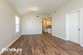 La Vergne house for rent - A room with wooden flooring and a white door.