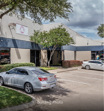 Dallas apartment for rent - a building with cars parked in front of it