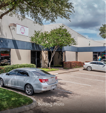 Dallas apartment for rent - A silver car is parked in front of a building with a sign that reads "Resort.".
