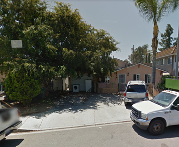 Escondido apartment for rent - a house with a parking lot and cars in front of it