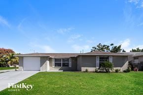 Port Richey house for rent - A house with a lawn in front of it.