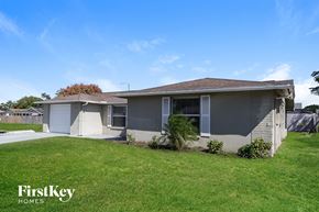 Port Richey house for rent - A house with a lawn in front of it.