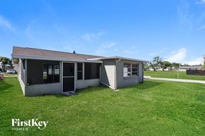Port Richey house for rent - A house with a lawn in front of it is for sale.