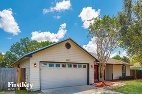 Jacksonville house for rent - the front of a white house with a white garage door