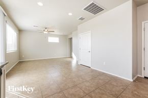 Vail house for rent - A spacious room with a ceiling fan and tile flooring.