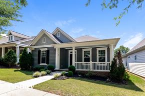 Belmont house for rent - A house with a grey front and white trim.