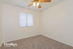 Tucson house for rent - the upstairs bedroom has a ceiling fan and a carpet