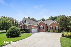 Kernersville house for rent - a brick house with a garage and a driveway