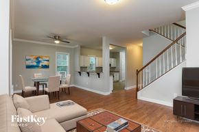 Raleigh house for rent - A living room with a couch, a coffee table, and a television.
