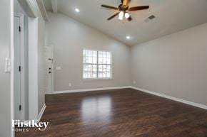 Antioch house for rent - A room with a ceiling fan and wooden flooring.
