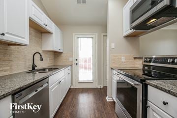 Antioch house for rent - A kitchen with a sink, stove, and oven.
