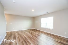 Lexington house for rent - the living room with hardwood floors and a large window