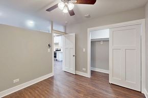 Oak Park apartment for rent - a living room with a ceiling fan and a door to a closet
