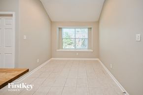 Houston house for rent - A room with a window and a wooden table.
