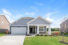 Indianapolis house for rent - a blue house with a white garage door