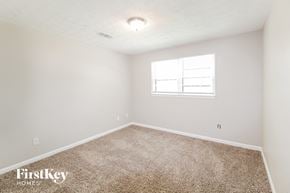Lawrenceville house for rent - a spacious room with carpet and a window
