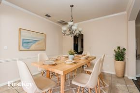 Fort Worth house for rent - A dining room with a wooden table and chairs.