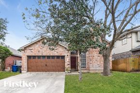 San Antonio house for rent - A house with a brown garage door is for sale.