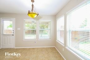 Mckinney house for rent - a dining room with large windows and a light fixture
