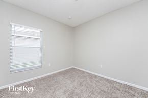 Poinciana house for rent - the upstairs bedroom has carpet and a large window