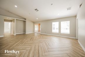 Lehigh Acres house for rent - the living room and dining room are spacious and light wood flooring