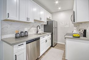 Scottsdale apartment for rent - a white kitchen with stainless steel appliances and white cabinets