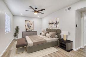 Scottsdale apartment for rent - a bedroom with a bed and a ceiling fan