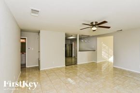 San Antonio house for rent - A spacious room with a ceiling fan and a tiled floor.